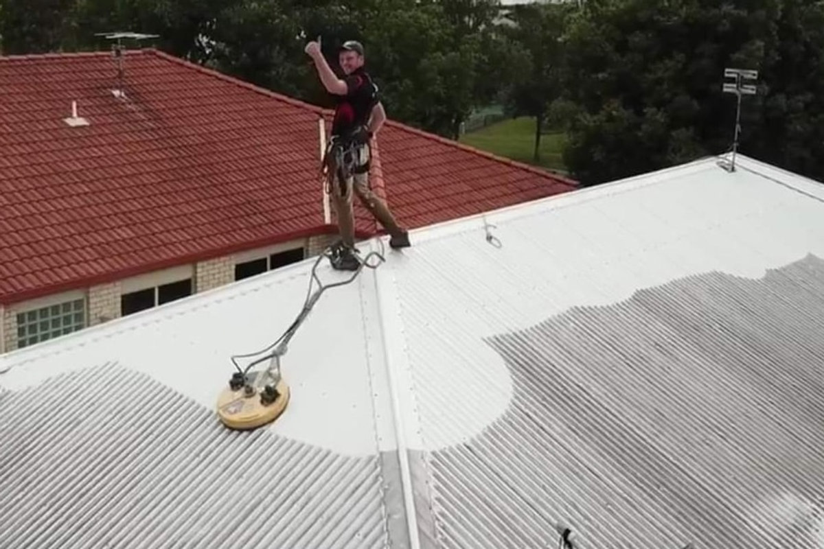 Roof mid-clean showing before and after